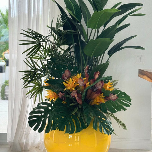 Mix of Tropical Plants in a Yellow Globe Planter The New Garden 